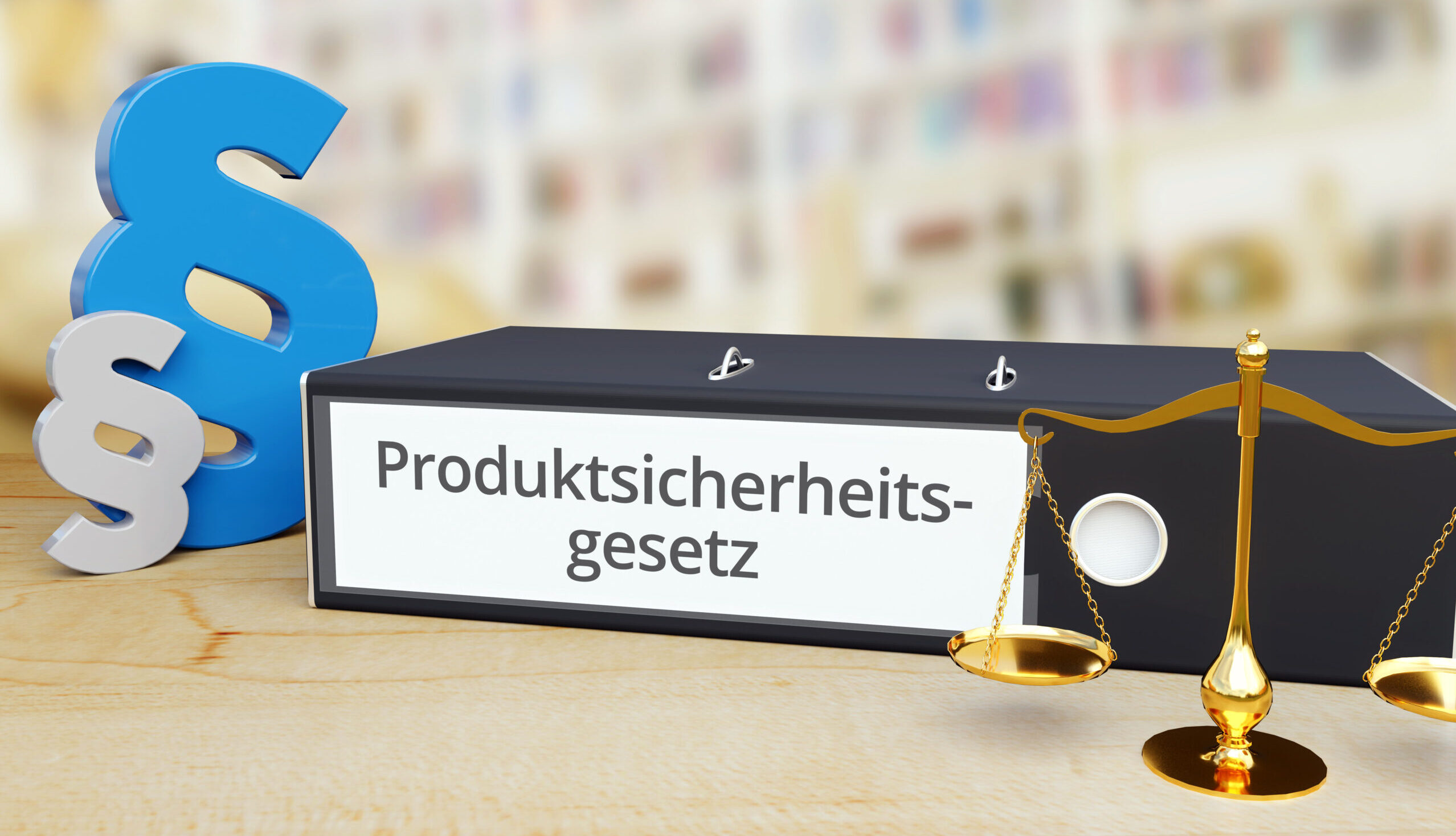 Ordnerrücken mit der Aufschrift »Produktsicherheitsgesetz«, dazu eine Waage und ein Paragrafenzeichen